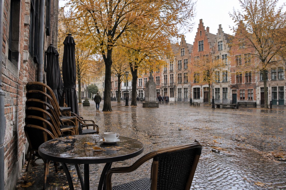 A European old town square in autumn with trees turning colour